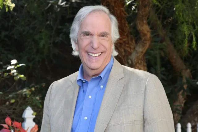 Henry Winkler is a name synonymous with cool. From his breakout role as the leather-clad Arthur "Fonzie" Fonzarelli on Happy Days to his recent Emmy-winning performance in Barry, Winkler's career has spanned over five decades, showcasing his remarkable versatility. But Winkler is more than just a TV icon; he's a producer, director, author, and a true Hollywood force. Early Life and Struggles: Born in New York City in 1945, Winkler's path to stardom wasn't always smooth. Diagnosed with dyslexia at a time when the condition was little understood, Winkler struggled in school and faced low self-esteem. However, his passion for acting never wavered. He persevered, attending Emerson College and the Yale School of Drama, honing his craft and laying the groundwork for his future success. The Rise of The Fonz: After graduating, Winkler faced the initial hurdles common to aspiring actors. His big break came in 1974 when he landed the role of Fonzie on Happy Days. Originally intended as a recurring character, Fonzie's popularity skyrocketed, catapulting Winkler to national fame. The character's cool demeanor, signature thumbs-up, and motorcycle became cultural touchstones, influencing fashion and pop culture for years to come. Beyond Happy Days: A Multifaceted Career While Happy Days cemented Winkler's place in pop culture history, his career has flourished far beyond Milwaukee's favorite greaser. He transitioned seamlessly into film roles throughout the 1970s and 80s, showcasing his range in comedies like Night Shift (1982) and thrillers like Scream (1996). Winkler didn't shy away from challenging himself behind the camera as well. He ventured into directing and producing, leaving his mark on shows like MacGyver. A Television Renaissance: The new millennium saw a resurgence in Winkler's television career. He embraced comedic roles, bringing his signature charm to shows like Arrested Development (as the unforgettable Barry Zuckerkorn) and Parks and Recreation (as the scene-stealing Dr. Saperstein). In 2018, Winkler finally received critical acclaim for his dramatic acting with his role as Gene Cousineau in the dark comedy Barry. The nuanced performance earned him a well-deserved Primetime Emmy Award for Outstanding Supporting Actor in a Comedy Series. More Than Just Hollywood: Winkler's influence extends beyond the silver screen. He's a passionate advocate for dyslexia awareness, using his own experiences to inspire others. He's also a prolific children's book author, demonstrating his commitment to literacy and education. Henry Winkler's Net Worth (2024): As of 2024, Henry Winkler's net worth is estimated to be around $40 million (according to CelebrityNetWorth). This impressive sum reflects his long and successful career in various aspects of the entertainment industry. Henry Winkler's Legacy: Henry Winkler is a true Hollywood icon. He's not just a nostalgic symbol of a bygone era; he's a constantly evolving artist who continues to surprise and entertain audiences. From overcoming learning challenges to achieving critical acclaim, Winkler's story is one of perseverance, talent, and a genuine love for his craft.