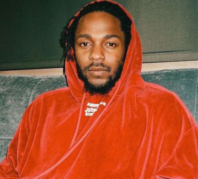 Kendrick Lamar Honors 2Pac with Matching Outfit & $600K Chain at "The Pop Out"